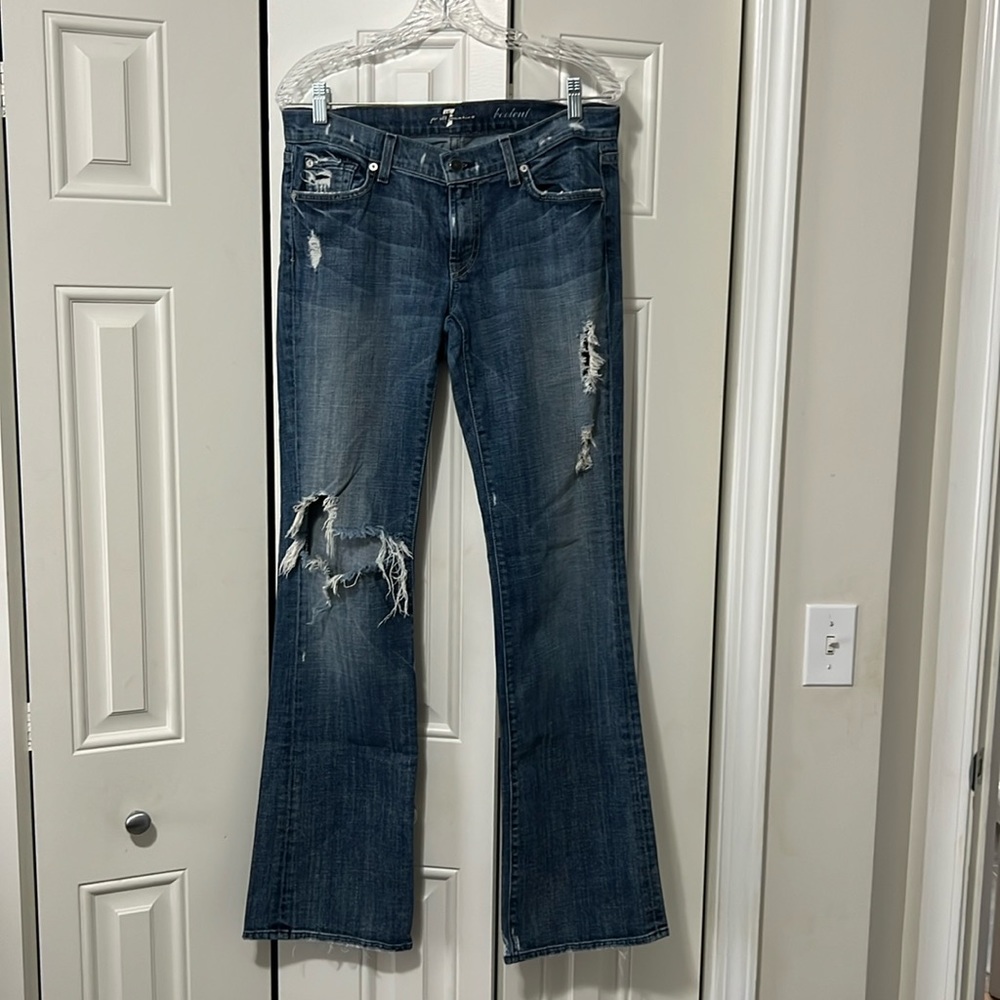 Vintage, low rise, 7 for all mankind jeans with distressing.
